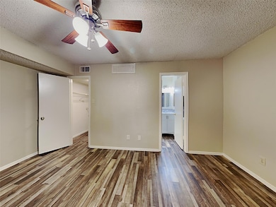 Unfurnished bedroom featuring ensuite bathroom, ce