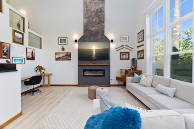 A large living room with elegant and functional furniture (the sectional is a very comfortable trundle bed sleeper) is tastefully decorated. The electric fireplace which can operate with or without heat, and the workstation provides flexibility.