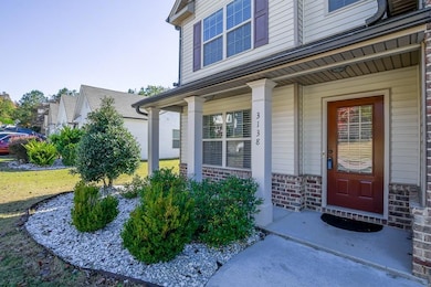Entrance to property featuring a porch and stone siding