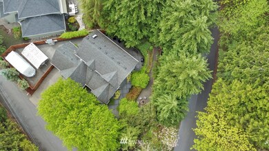 Unsurpassed privacy with this corner lot!  Easily maintained floor surrounding home with EXTENSIVE cement tiles.  Multiple water resources around property including hot water as well as convenient electrical outlets.  NOTE RV PARKING area accessible with 2 drive thru gates in fence. Flexible space is also excellent for additional outdoor activities.  