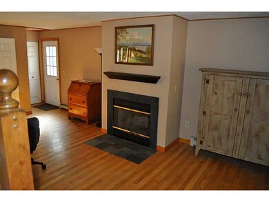Living Room. Cozy fireplace, hardwoods, back door