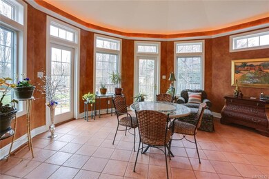 Beautiful sun room addition with cove lighting.