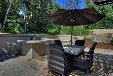 Amazing Backyard Boasts Built-In BBQ with Bar Seat