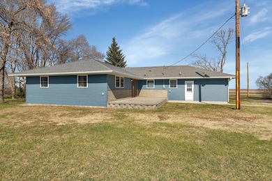 The home features newer vinyl siding and newer architectural shingles. There is a large stamped concrete patio with decorative block sides off the backside of the home. Patio added on in 2016.