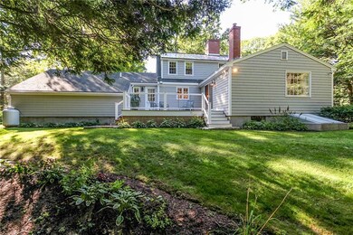 Well landscaped back yard has wooded...