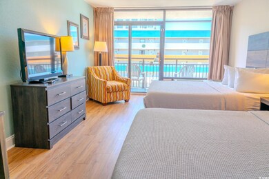Bedroom featuring light wood-style floors and multiple windows