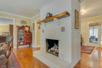 Gorgeous painted fireplace is the center of the dining, living and office space. 