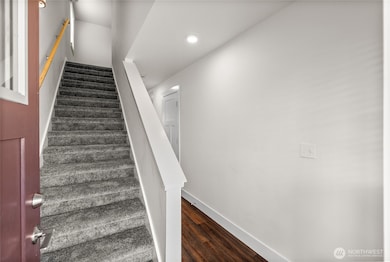 As you enter the home you can either take the stairs to the second level or continue onto the main floor living space.