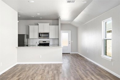 The open-concept kitchen overlooking the entertain