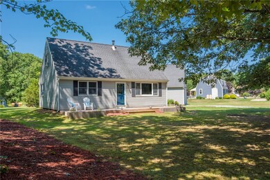 Front of home with a large deck with plenty of spa