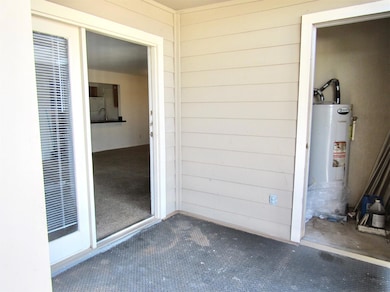 Doorway to property with water heater