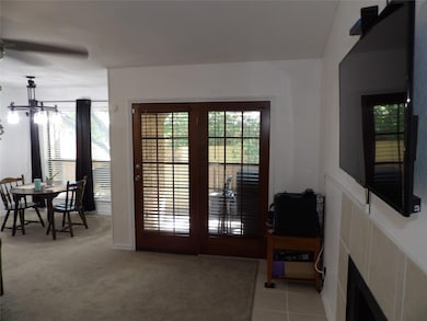 Doors to the back balcony/patio looking over a com
