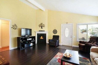 Bright and sunny living room features new floors, 