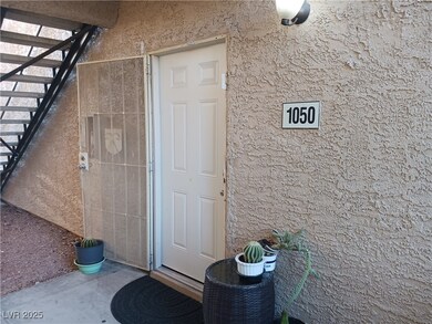 View of exterior entry with stucco siding