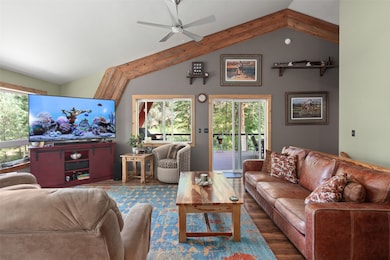 Living area featuring wood finished floors and ceiling fan