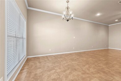 Unfurnished room with an inviting chandelier, base