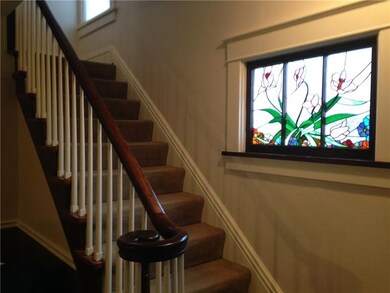 Beautiful Stairway with stained glass window
