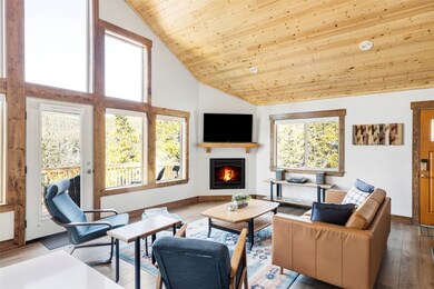 Living room with high vaulted ceiling, wood-type f