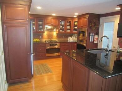 Cherry cabinets with beveled glass,...
