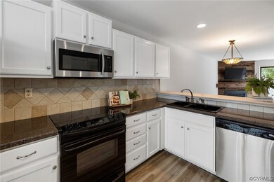 The kitchen opens to the dining room and living ro