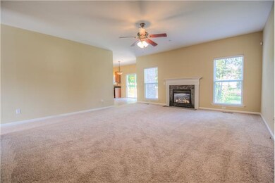 The spacious living room with fireplace.