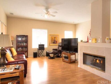 Large living room w/ Fireplace and ample windows