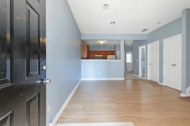 Entrance foyer with light hardwood / wood-style fl