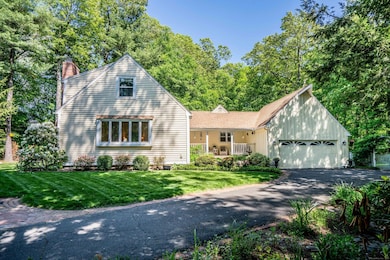 Enjoy the views of gardens, birds and privacy from a rocking chair on your west-facing front porch.