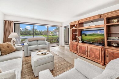 Living room featuring light parquet flooring, beau