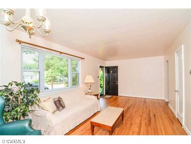 Living Room - Spacious great room has room for tv as well as an additional dining area. Gorgeous refinished hardwood floors!