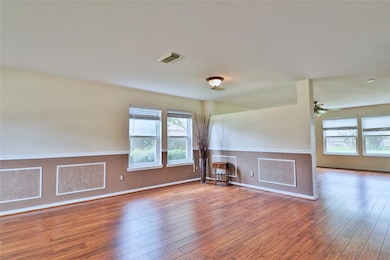 bright, open living  and dinning area with decorat
