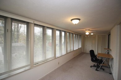 You'll enjoy this spacious sun room, perfect for reading, crafts or home office.