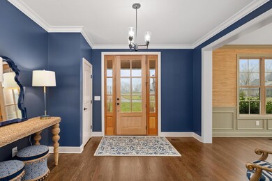 Beautifully Accented Entry with Gorgeous Hardwood Flooring!  