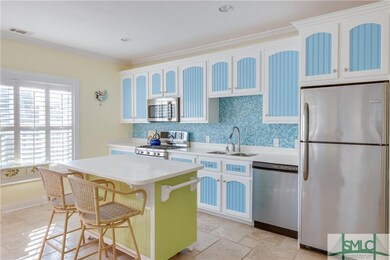Kitchen has updated cabinets, appliances including