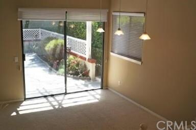 Living room has access to the patio and includes a
