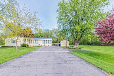 Long driveway with turn around offers plenty of pa