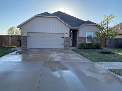 Ranch-style house featuring board and batten sidin