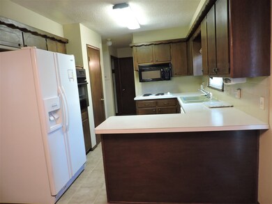Eating bar in kitchen and built in microwave