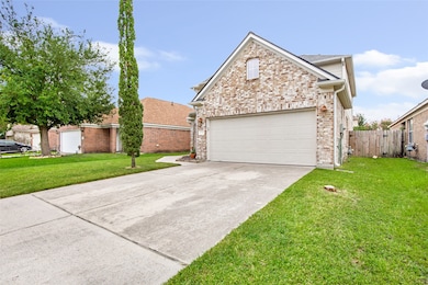 This photo features a charming brick two-story hom