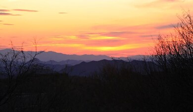 Sun setting across the mountains