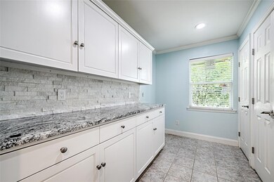 Kitchen featuring light tile patterned floors, whi