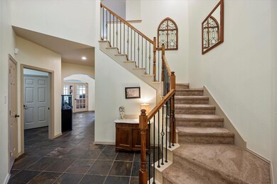 Stairs with dark tile patterned flooring and a tow