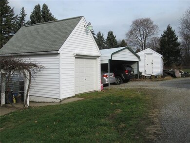 One Car Garage and 2 Car Carport