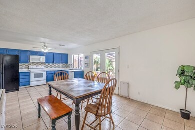 Dining area featuring light tile patterned floors,
