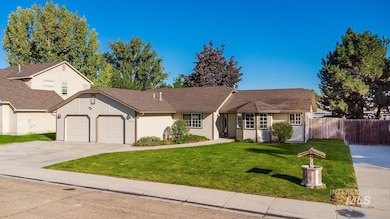 View of front of home featuring driveway and a garage
