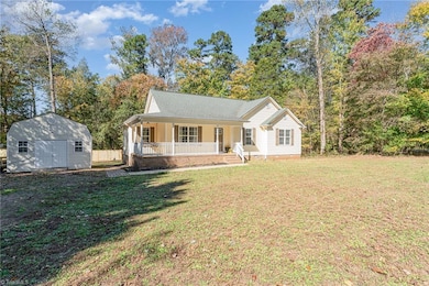 Front of home with storage building