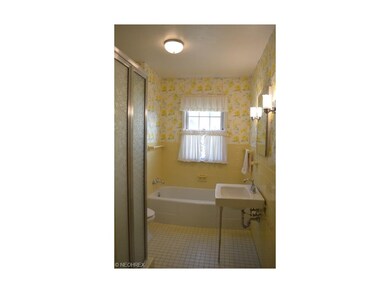 Bath with shower, newer toilet and tub.