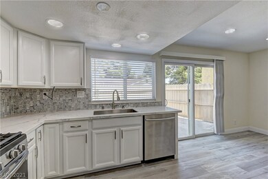 Custom backsplash and stainless steel appliances