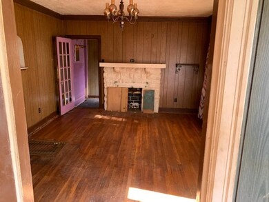 Fireplace located in the living room to the right 