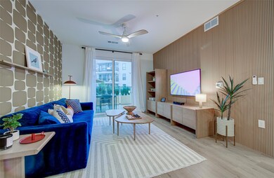 Living area featuring wood finished floors, ceili